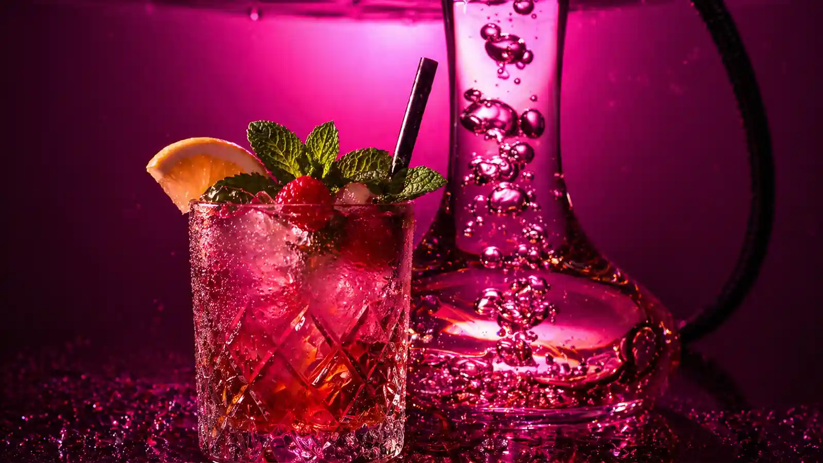 Berry mocktail beside a shisha pipe in hot pink lighting for a Bradford night out