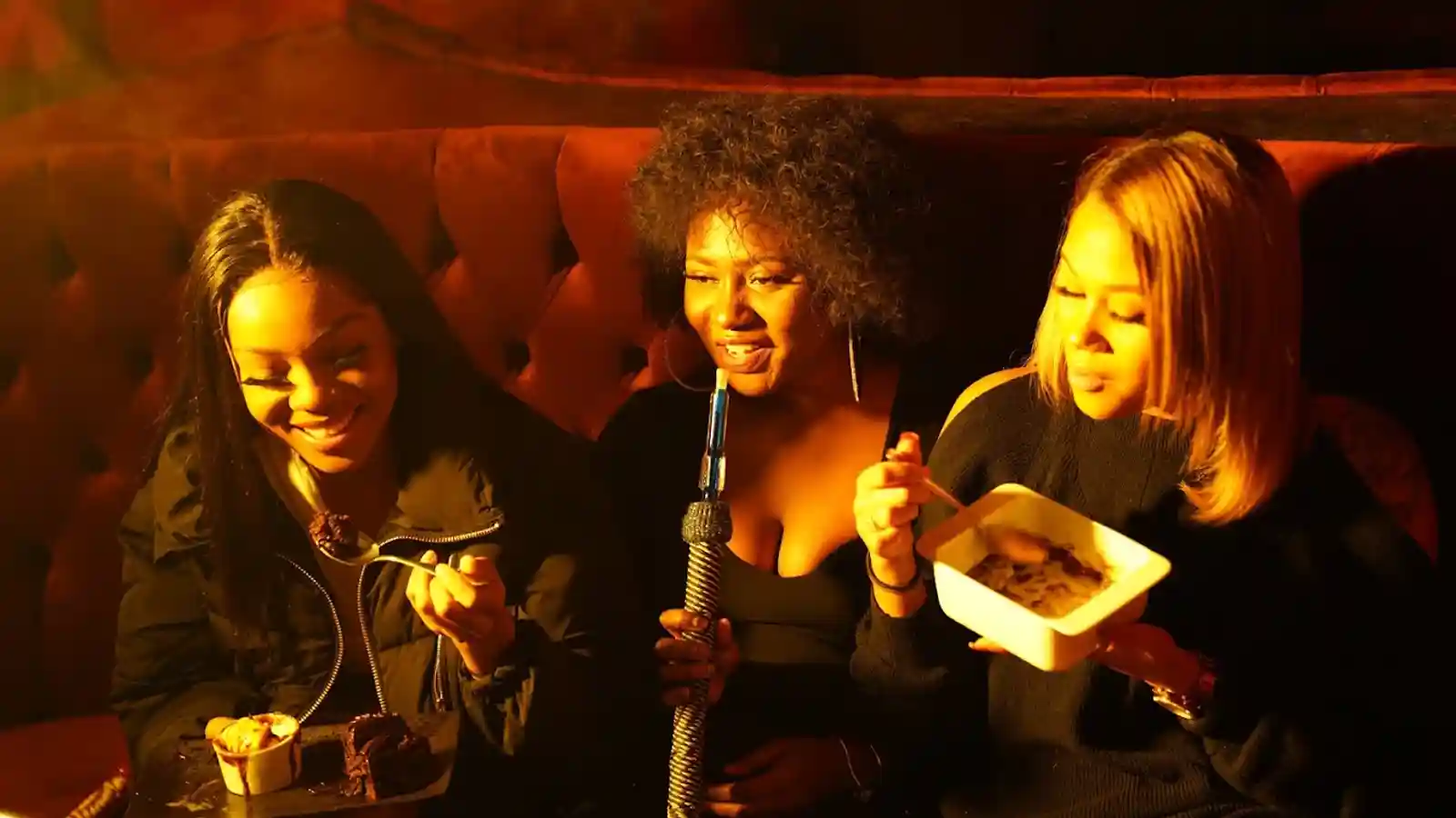 Students sharing shisha and desserts during a warm late-night lounge visit in Bradford